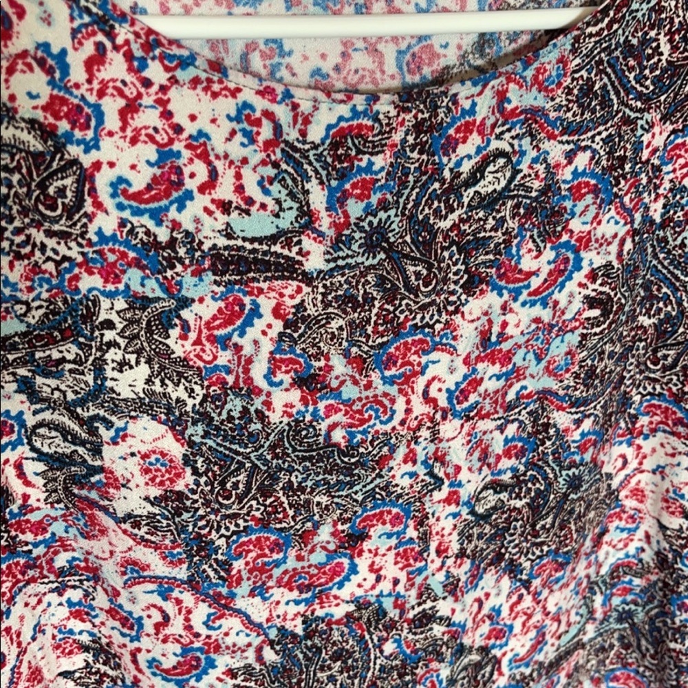 ReneeC. Size small, small Boutique, colored are black, red & blue. Worn once.